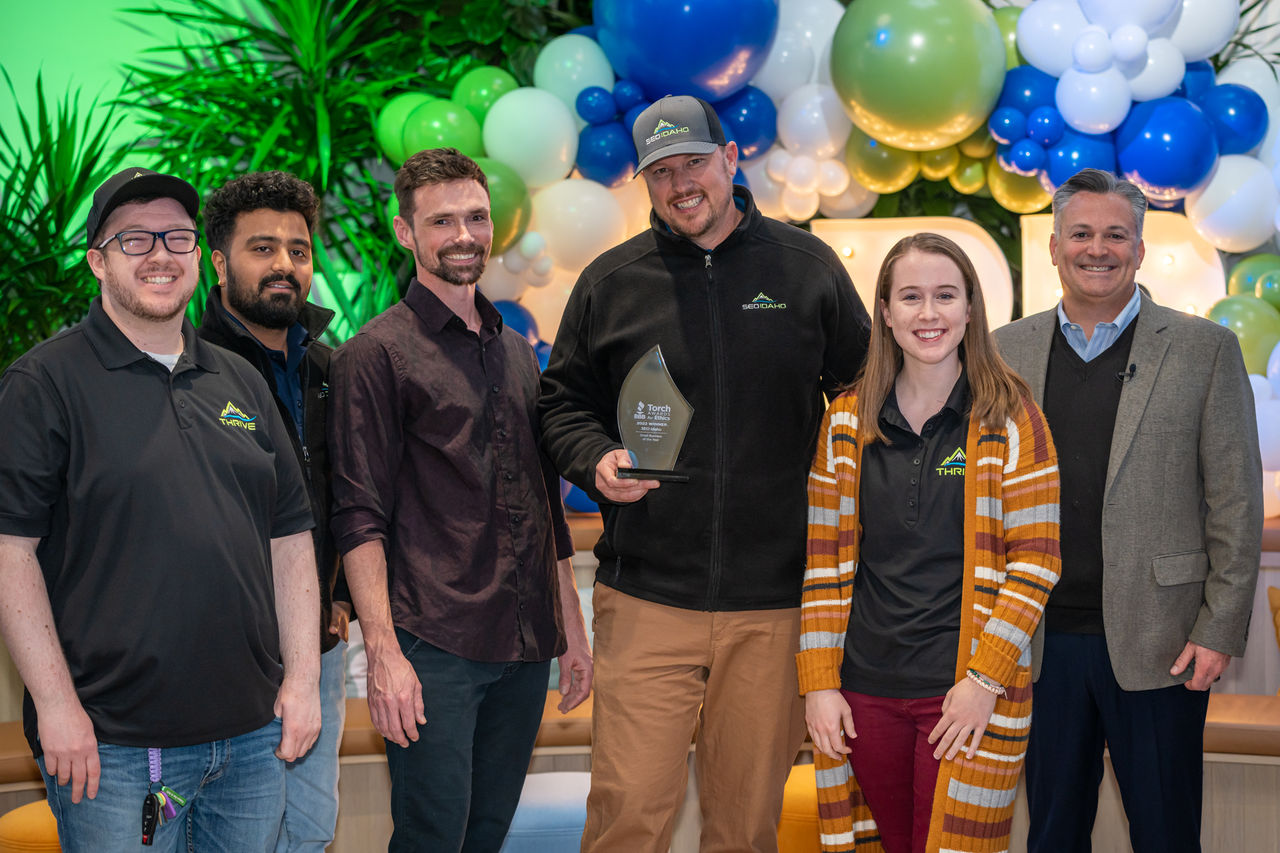 2022 Torch Award Winners, SEO Idaho, and Tyler Andrew, CEO of BBB GWP, at the BBB Open House in Kiln Meridian