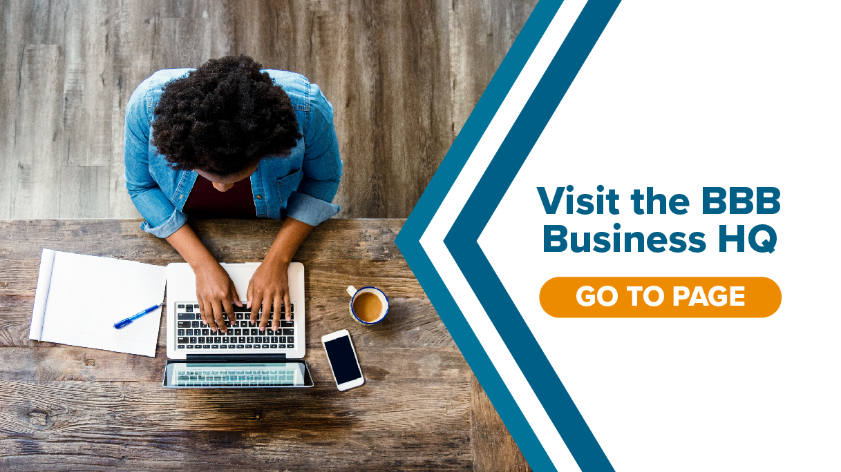 visit the business hq blue text white background next to image of a person working on a laptop