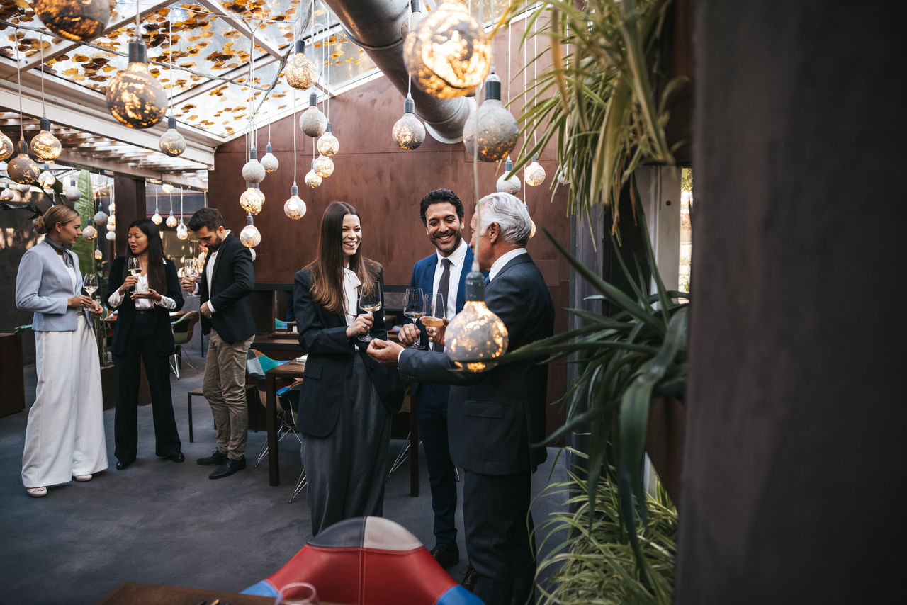 Corporate business people meet and drinking on a celebration event in a luxury hotel restaurant