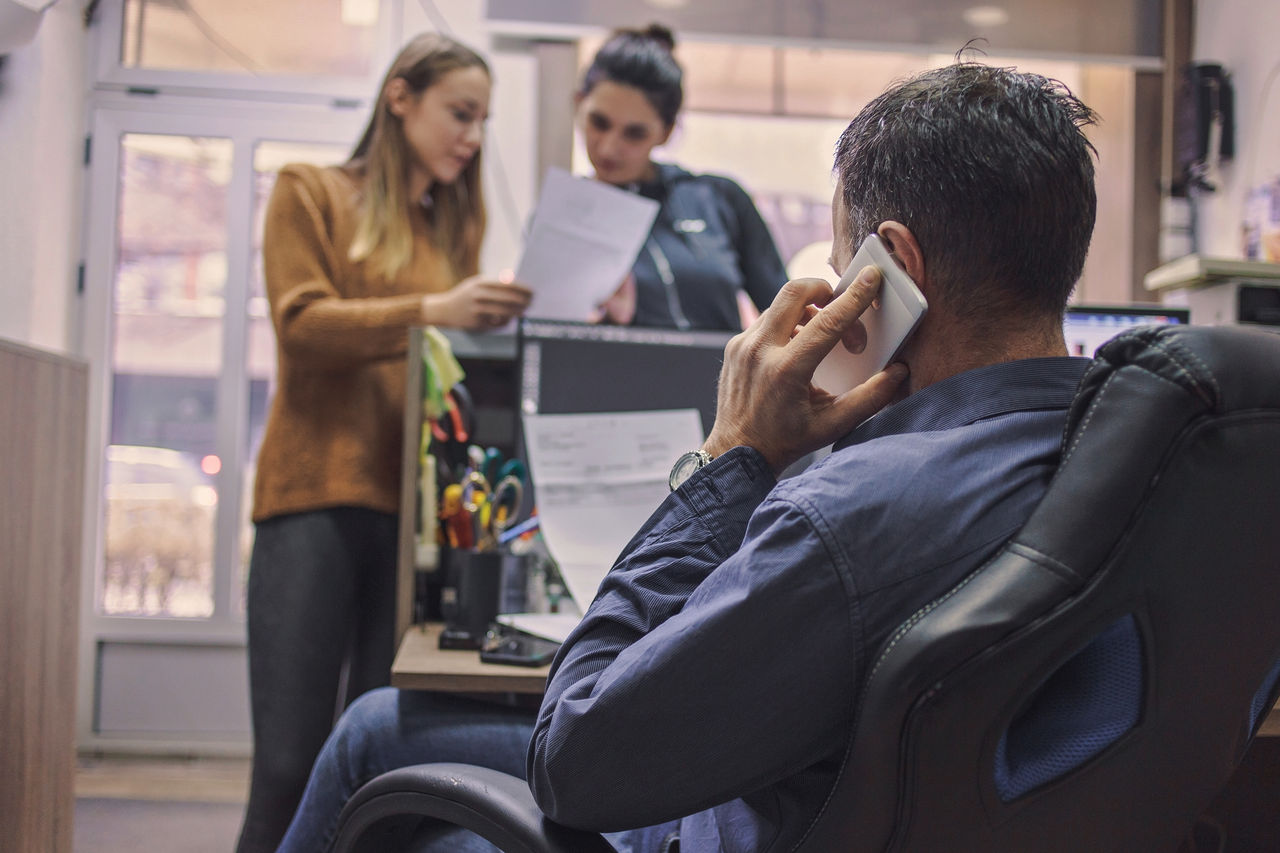 Woman and man working in printing centar