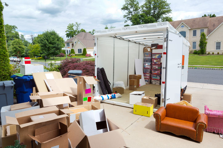 a portable storage unit is being loaded to a residenceBuilding and Construction