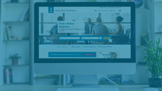 computer with bbb landing page on blue overlay