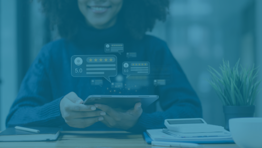 woman leaving review on tablet with blue overlay