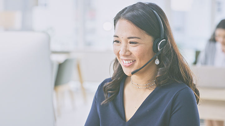 Woman, smile on computer and call center communication, customer service or e commerce support in office. Professional advisor, virtual assistant or Asian consultant for contact us and business FAQ