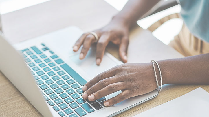 Hands typing on keyboard