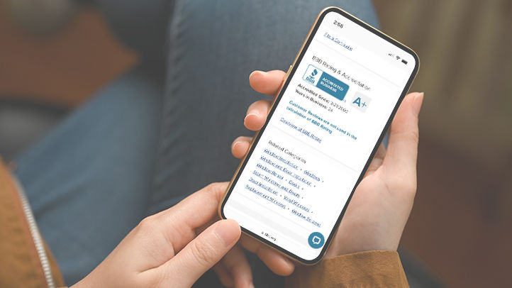 Close-up, focus hands, Female in casual outfit, sits and relaxes at living room, using smartphone