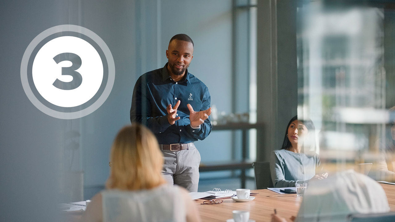 Cheerful female multi racial business owners standing with open sign in front of hair salon.