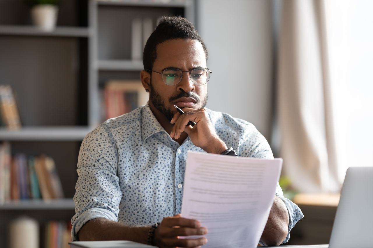 person reading eligibility guidelines for the awards