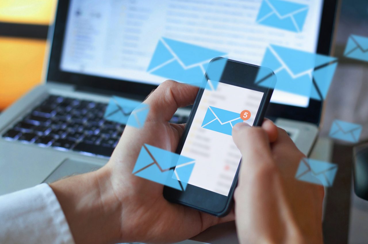 email marketing concept, person reading e-mail on smartphone, receive new message