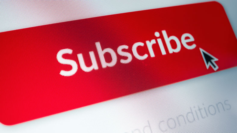 Close-up Macro Shot: Touch Screen Device With Open Application Showing Sing Up "Subscribe" Button. Digital Service Subscribe Concept: Video Streaming, Application, Newsletter