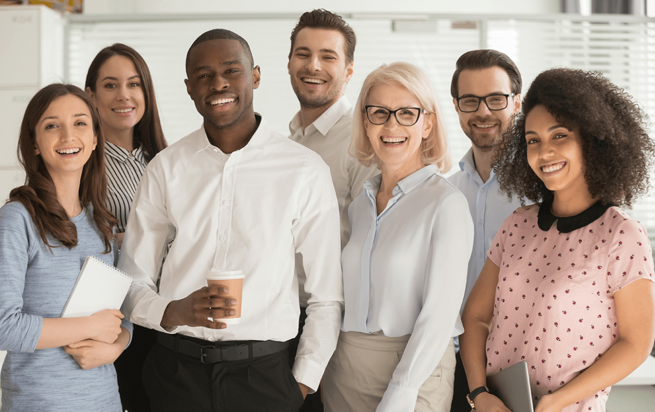 Corporate team smiling at work