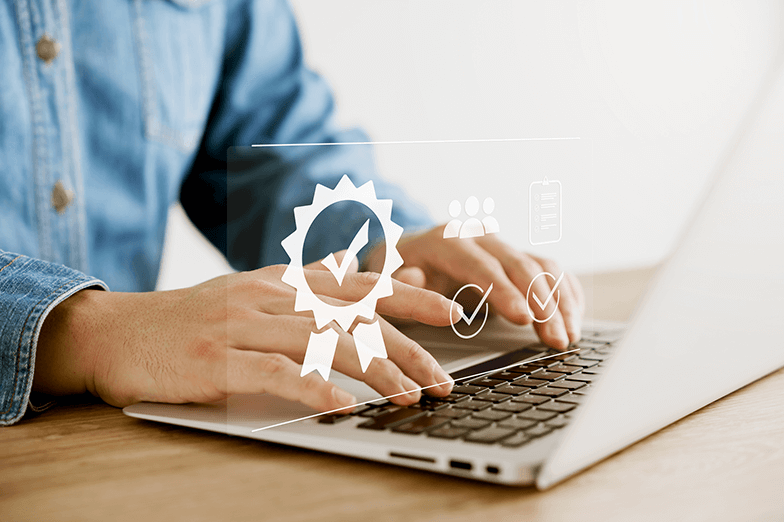 Person using laptop with reward icon overlay