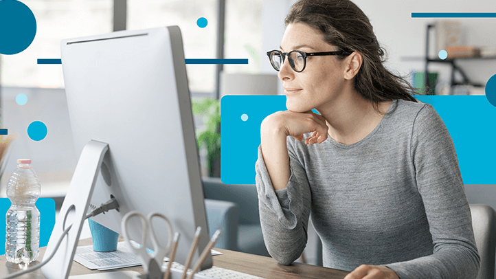 Woman working at home looking at her computer