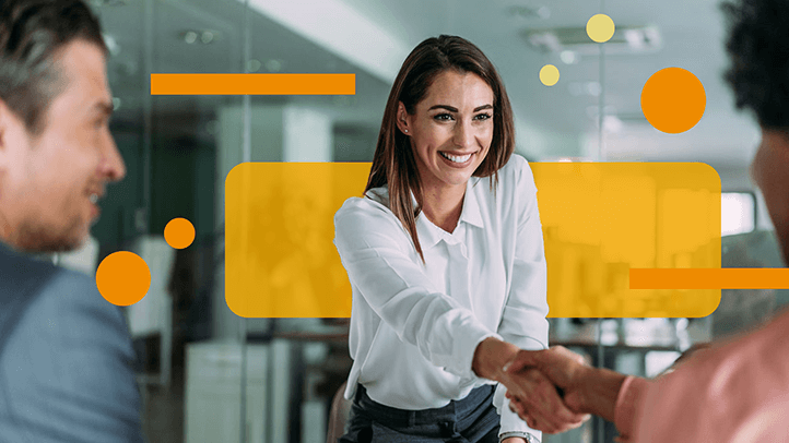 Woman shaking hands of two clients