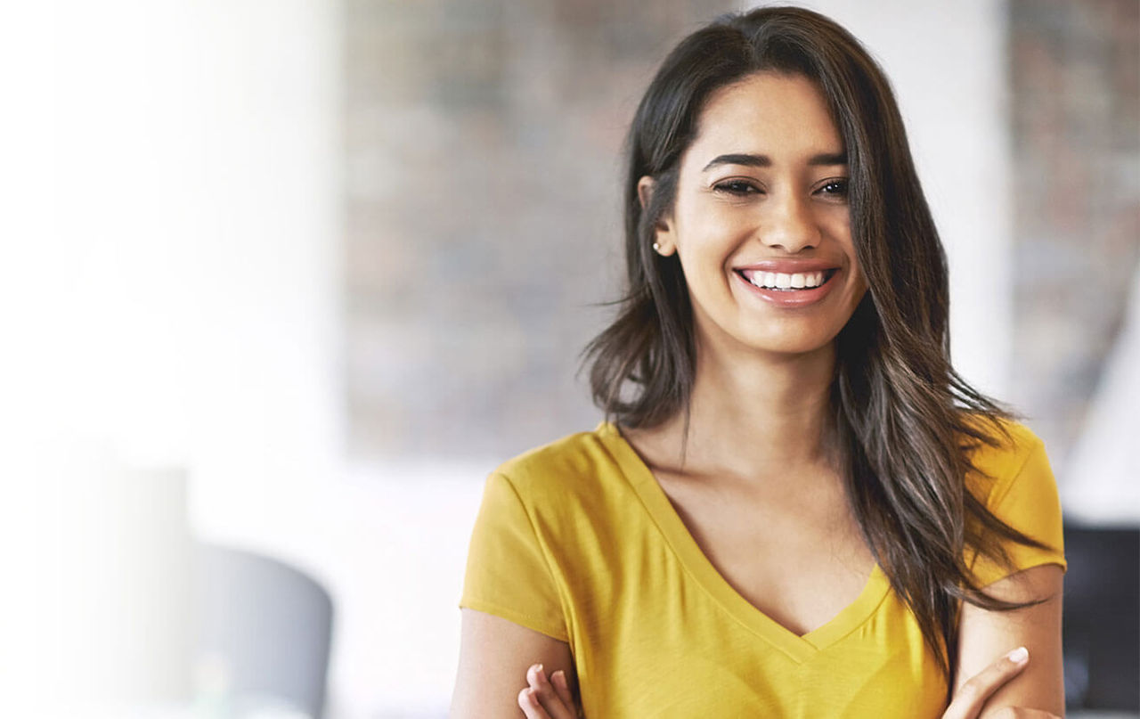 Woman in yellow shirt smiling