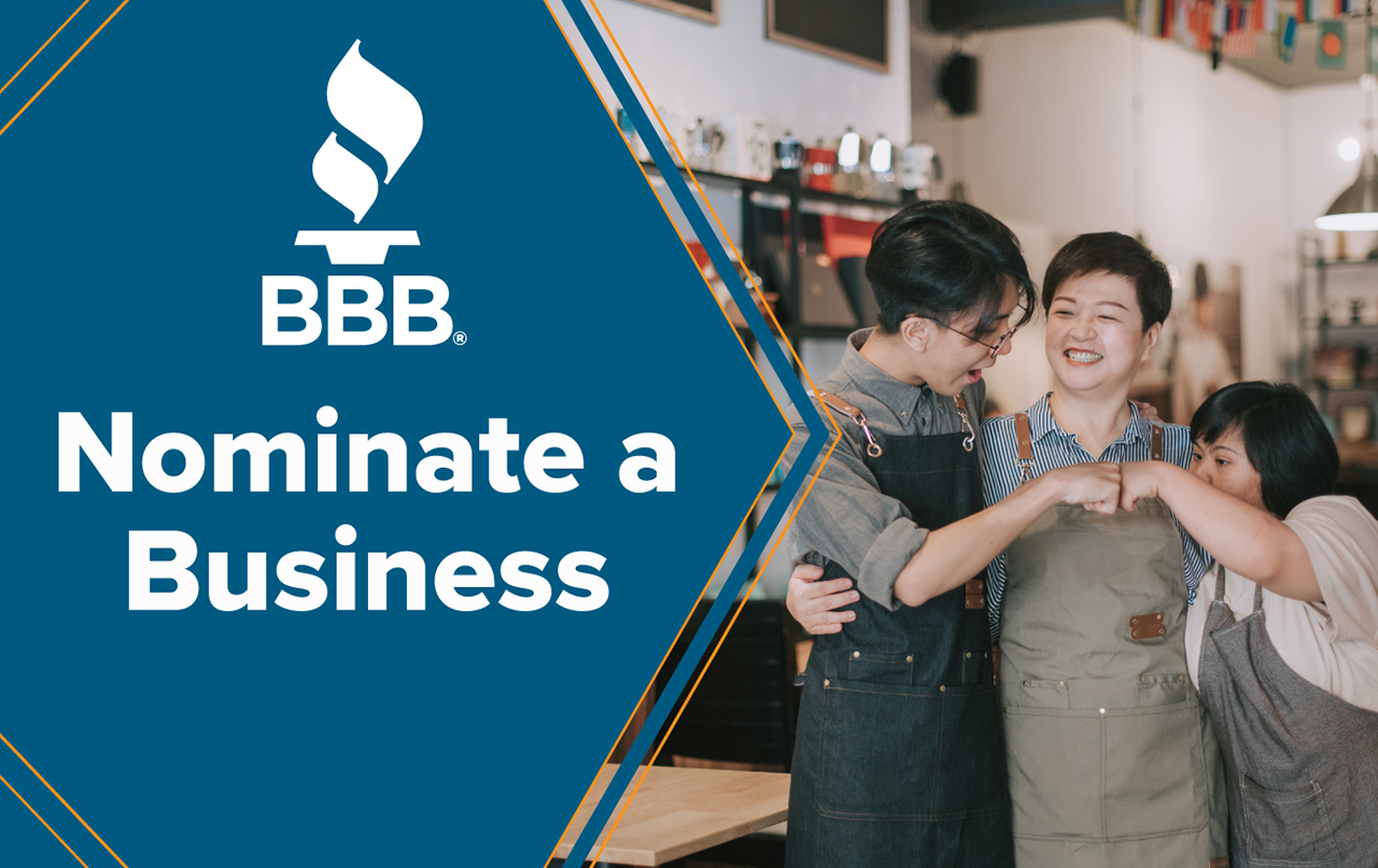 Torch Awards Logo Image - Small Business Owner Smiling with Team Members