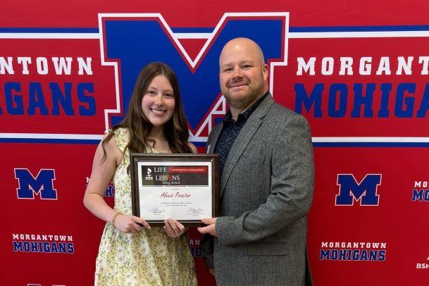 High school student receiving scholarship award
