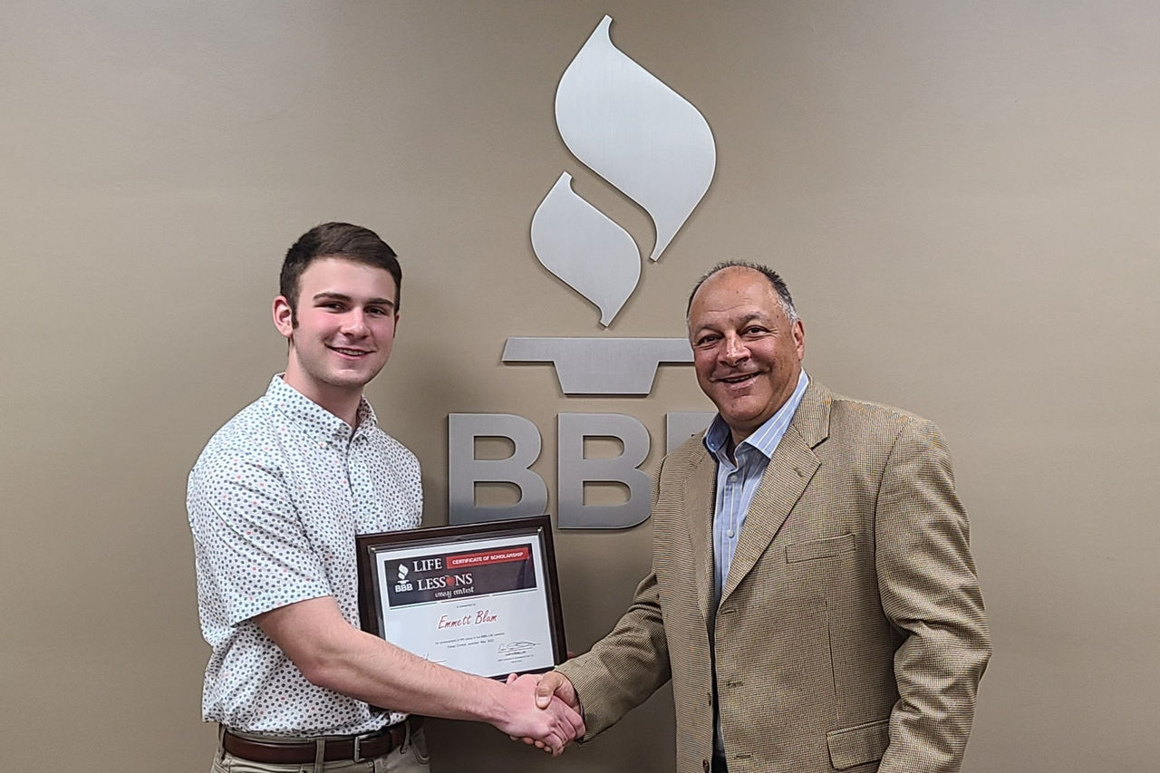 Emmett Blum received scholarship award from BBB CEO Frank Cilona