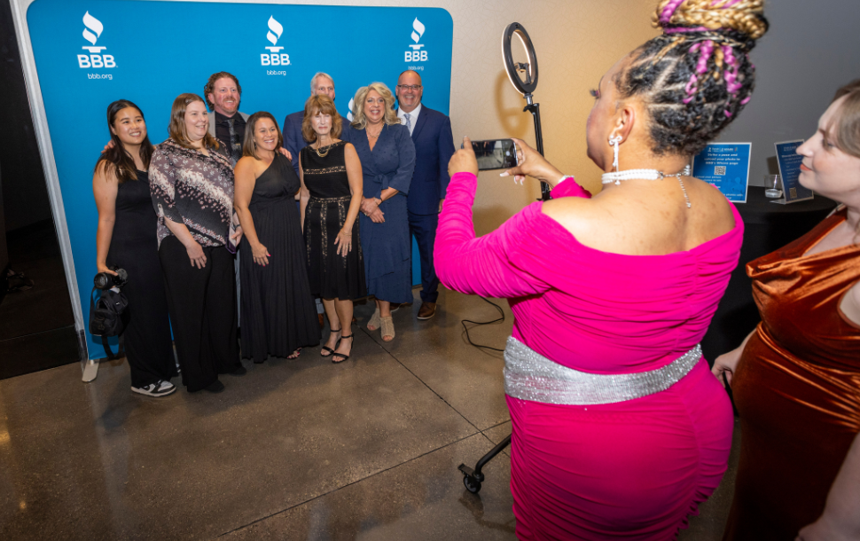 The LeafGuard Cincinnati team strikes a pose at the BBB Torch and Spark Awards photo booth.