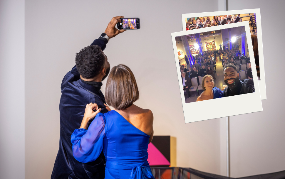 Emcees Freddy Mac and Cassy Arsenault take a selfie with the crowd before the live awards show.