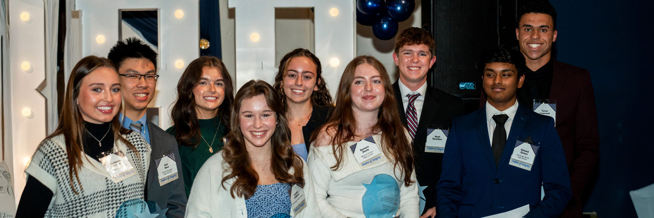 Smiling High Schoolers getting awards
