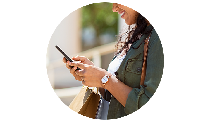 Closeup shot of shopper on cell phone
