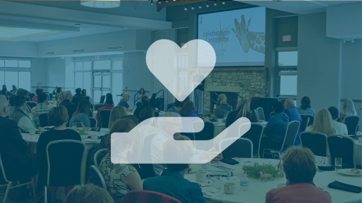 Clickable image of the audience at BBB Serving Greater Cleveland's 2019 Celebration of Integrity overlaid with blue tint and open hand with heart icon overlaid