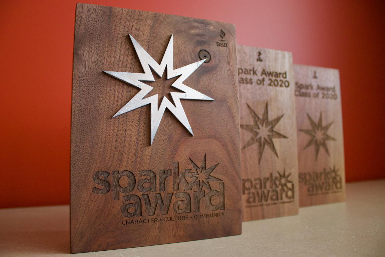 Picture of 3 wooden Spark Award plaques given to the Spark Award Class of 2020