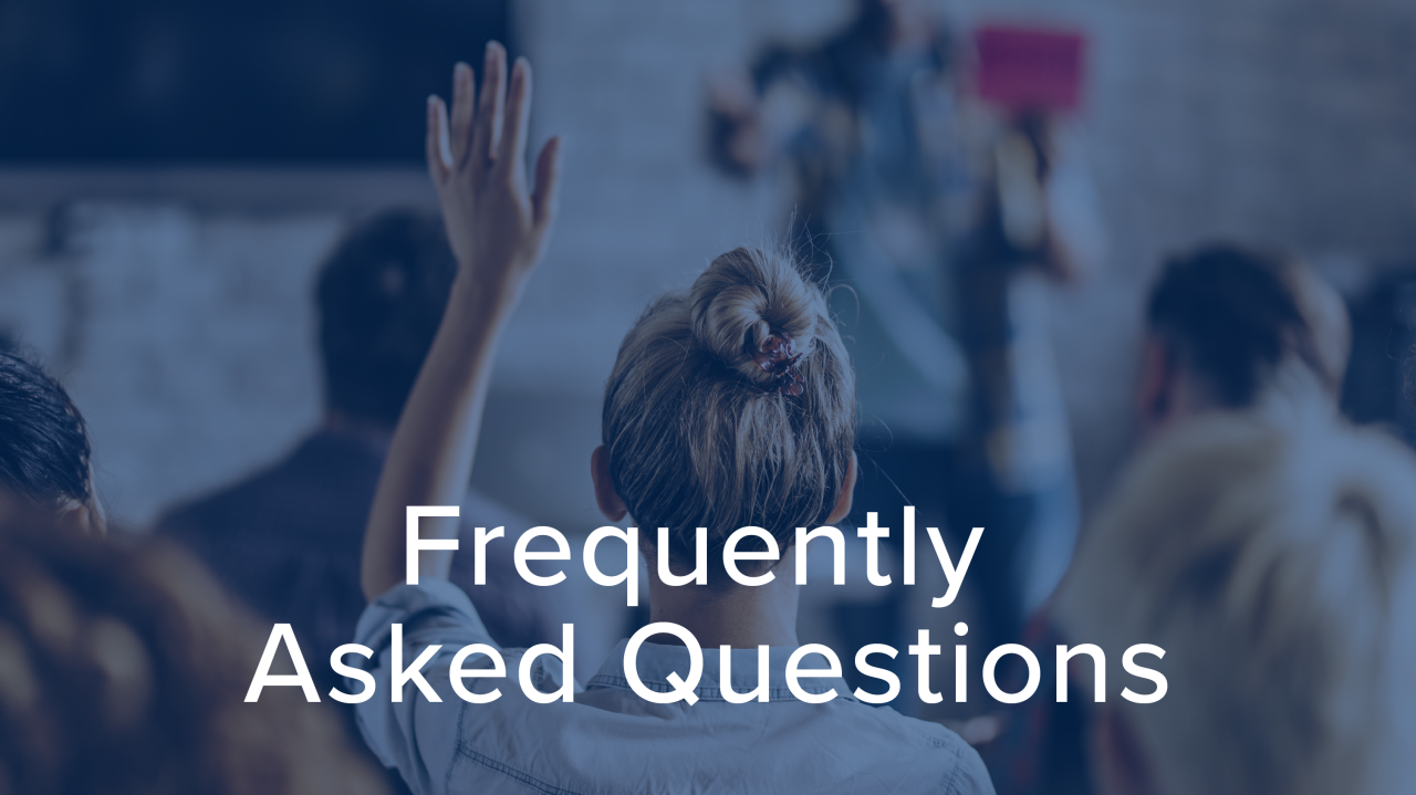 Woman with her hand up to ask a question