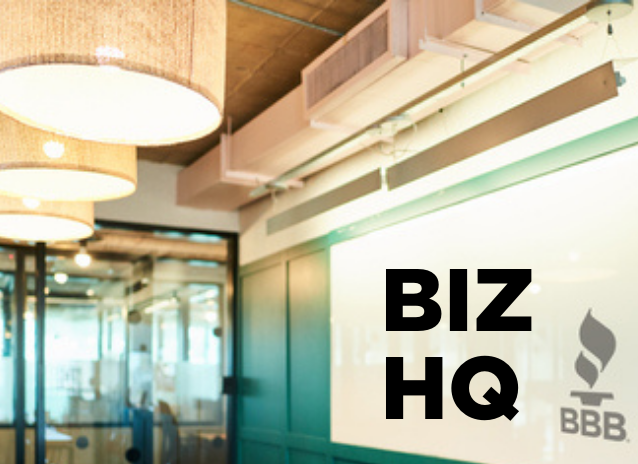 Office with table and BBB logo on wall with BIZ HQ in writing