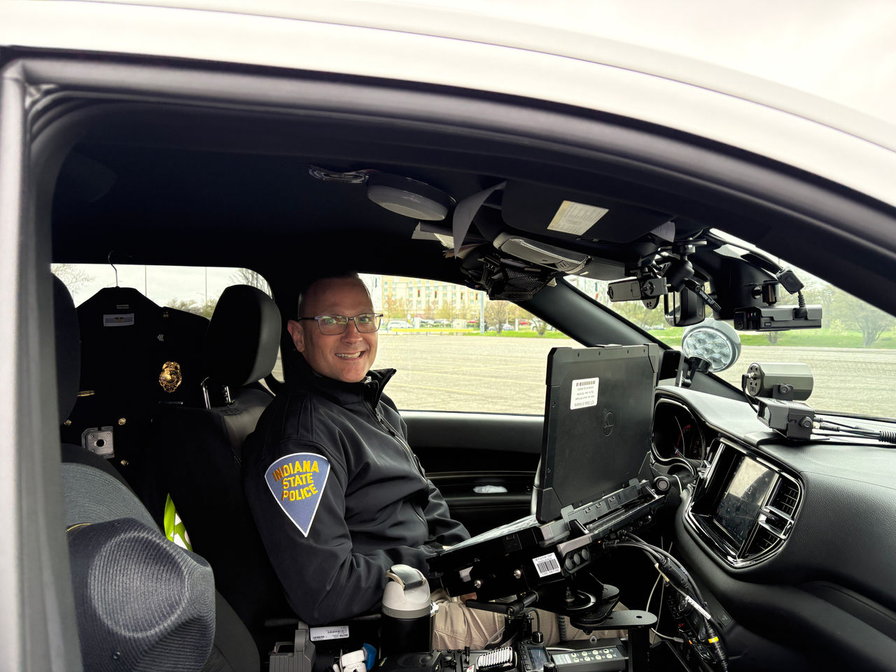 Sgt in his car smiling