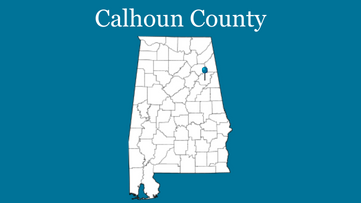 Blue background with outline of Alabama with blue pin on Calhoun County and the words Calhoun County up top