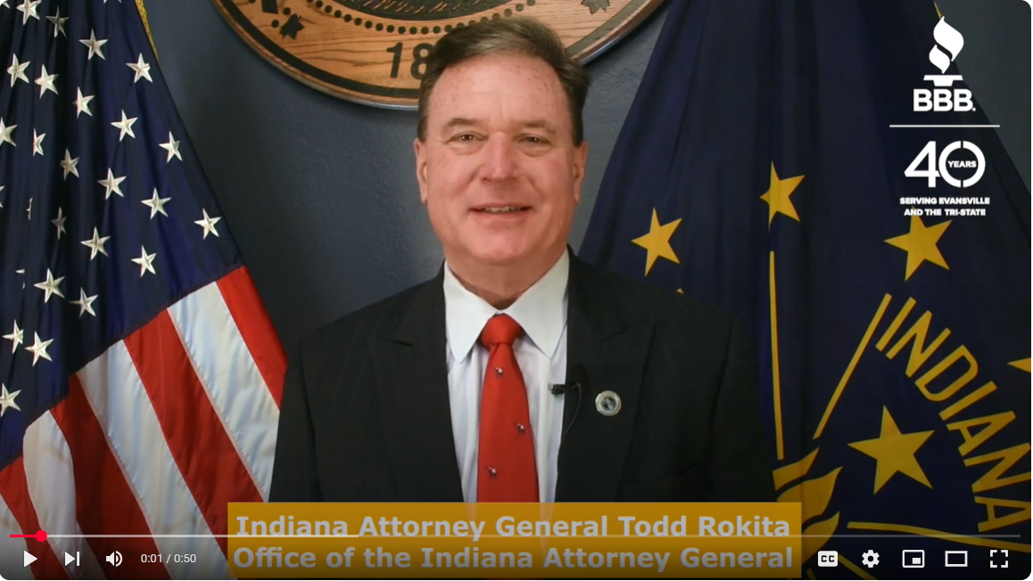 Indiana Attorney General Todd Rokita stands at a podium with an American flag and Indiana flag behind him