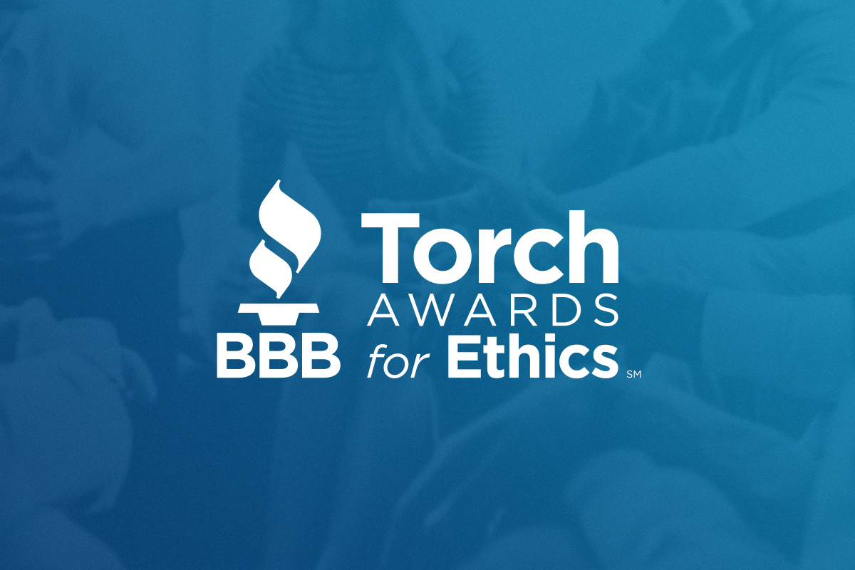 Torch Awards for Ethics Logo white on blue background