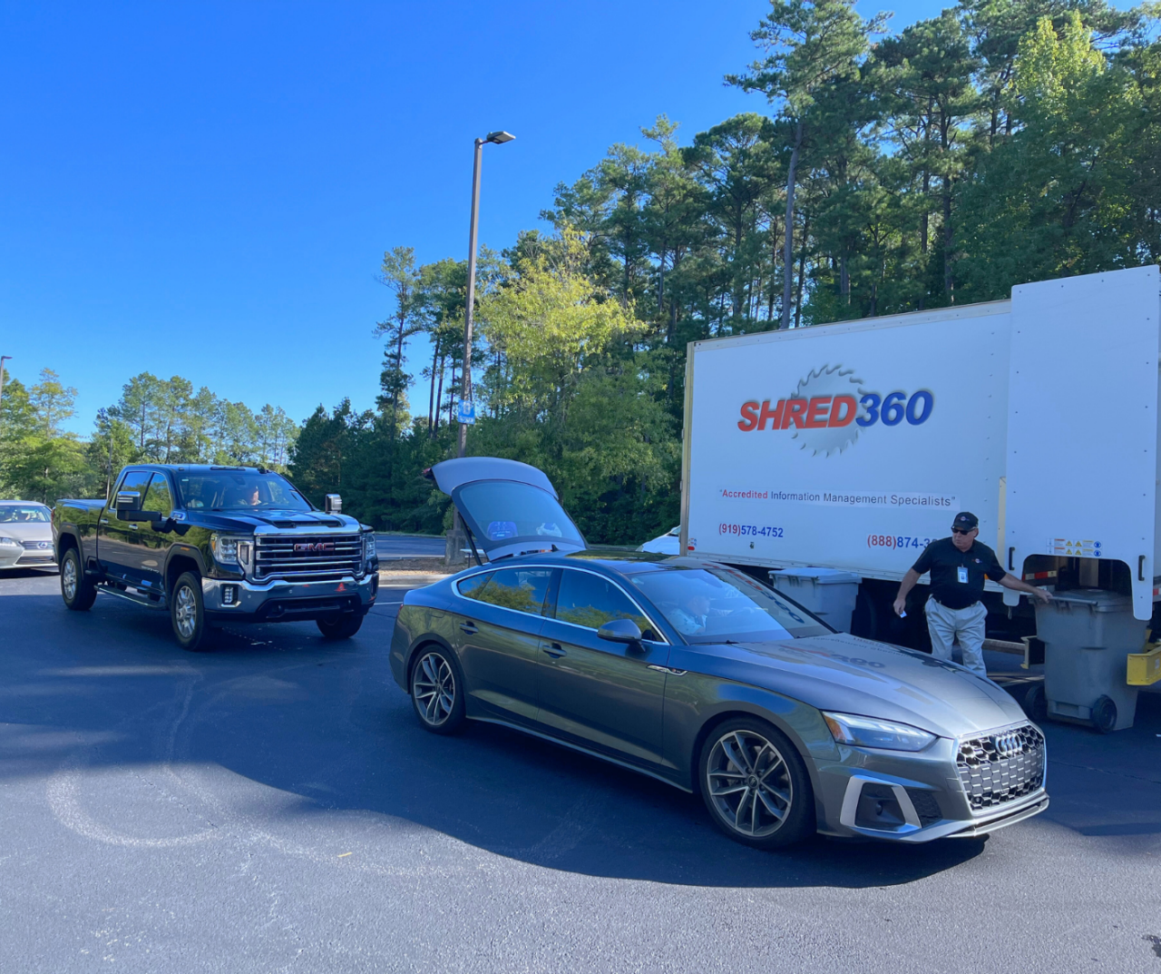 Line of cars and shredding truck at one of BBB's shred events.