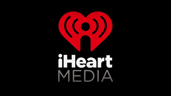 iHeart Media logo red heart white letters black background