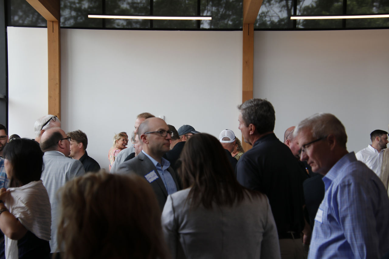 Group of individuals standing together and mingling