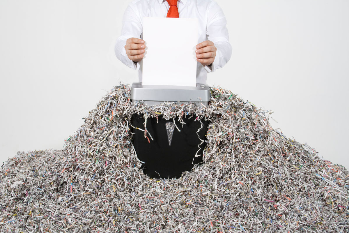 a person shredding documents