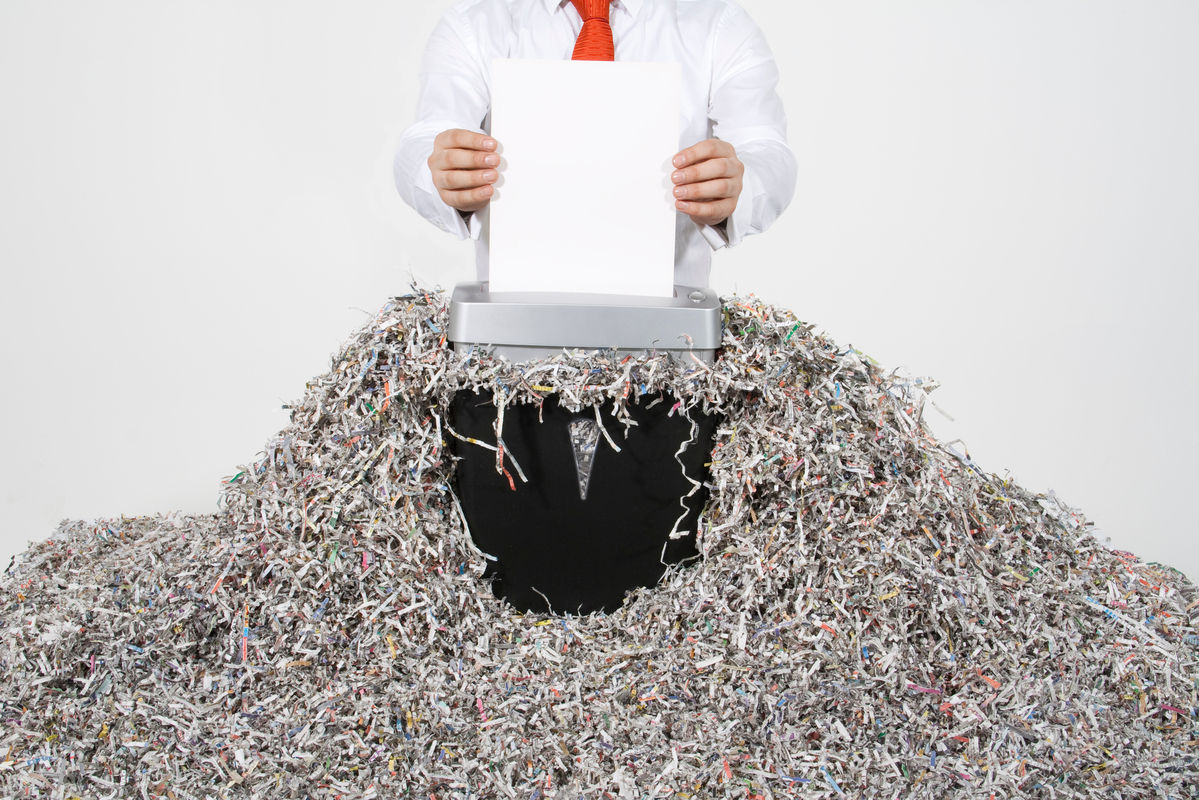 a person shredding documents