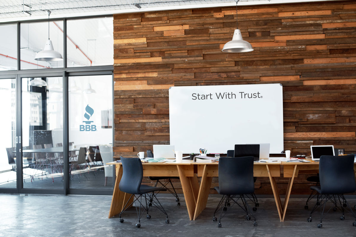 Shot of a whiteboard, table and chairs in an empty office