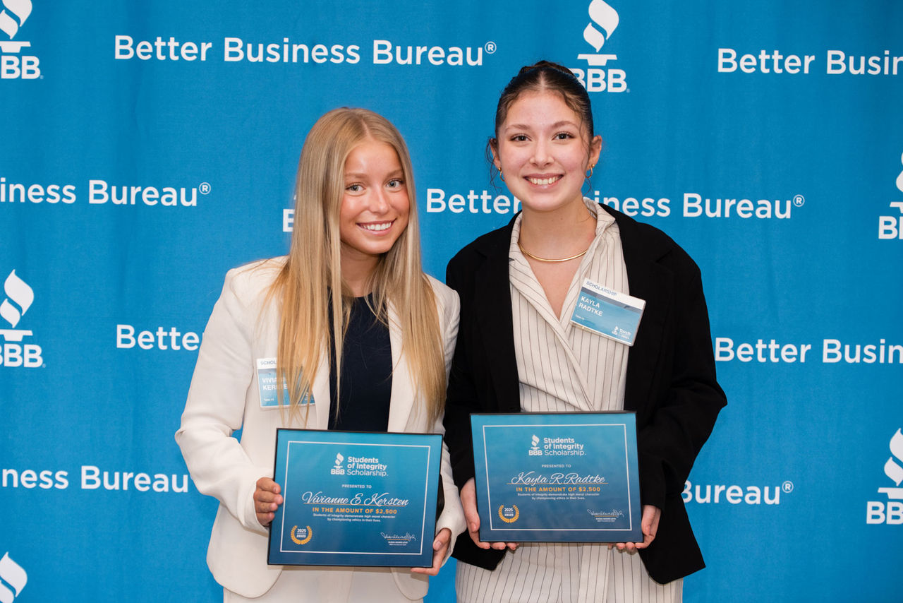 Student Savanna Loken poses with her SOFI Award