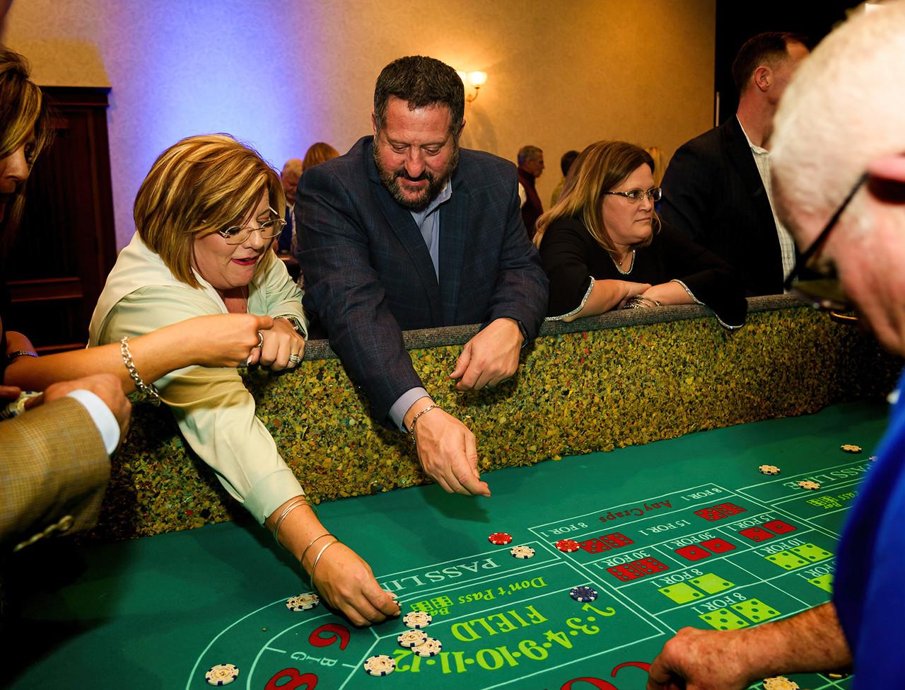 group of people playing at the casino