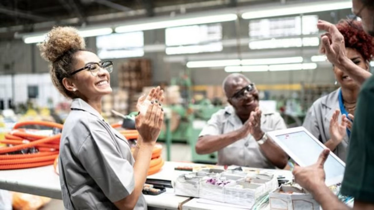 Group of employees clapping their hands