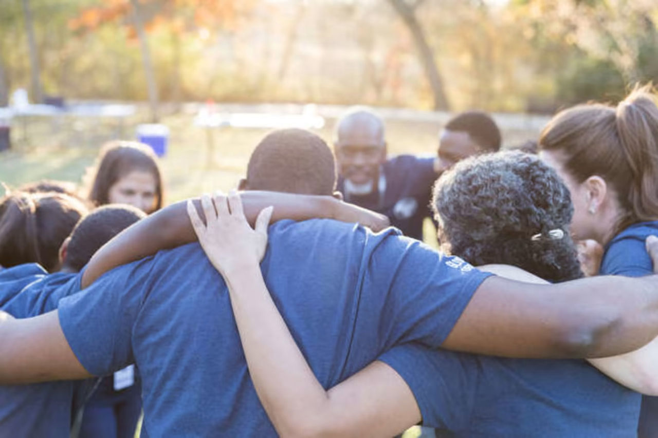 Team of people in a huddle