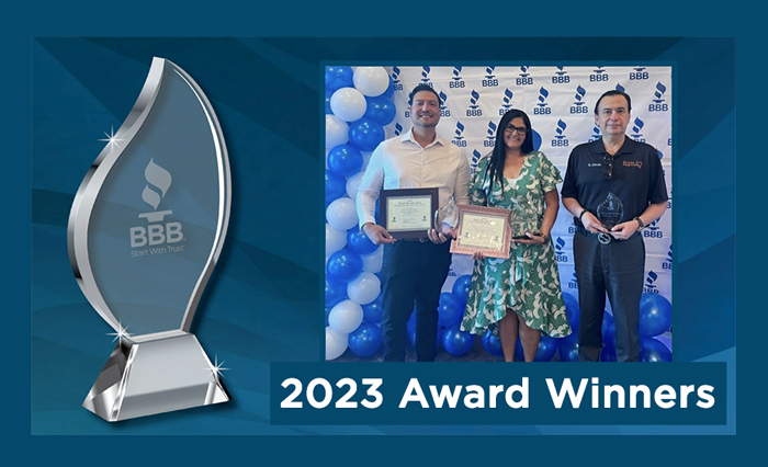 Three Winners holding awards, blue background with white text stating 2023 winners