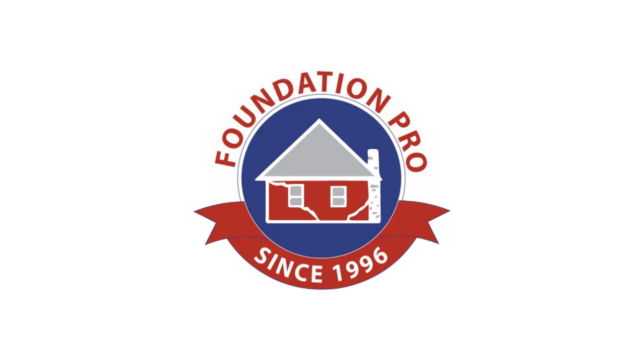 Logo for Foundation Pro, featuring a red house with a visible white foundation set against a blue circular background. A red banner below the house reads 'Since 1996', and curved text above the circle reads 'Foundation Pro' in red.