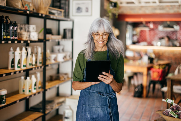 Senior woman as successful entrepreneur and happy owner