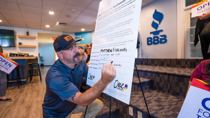 CEO Matt Fehling signing the ONE Community Pledge