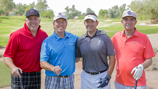 group of golfers smiling for the camera