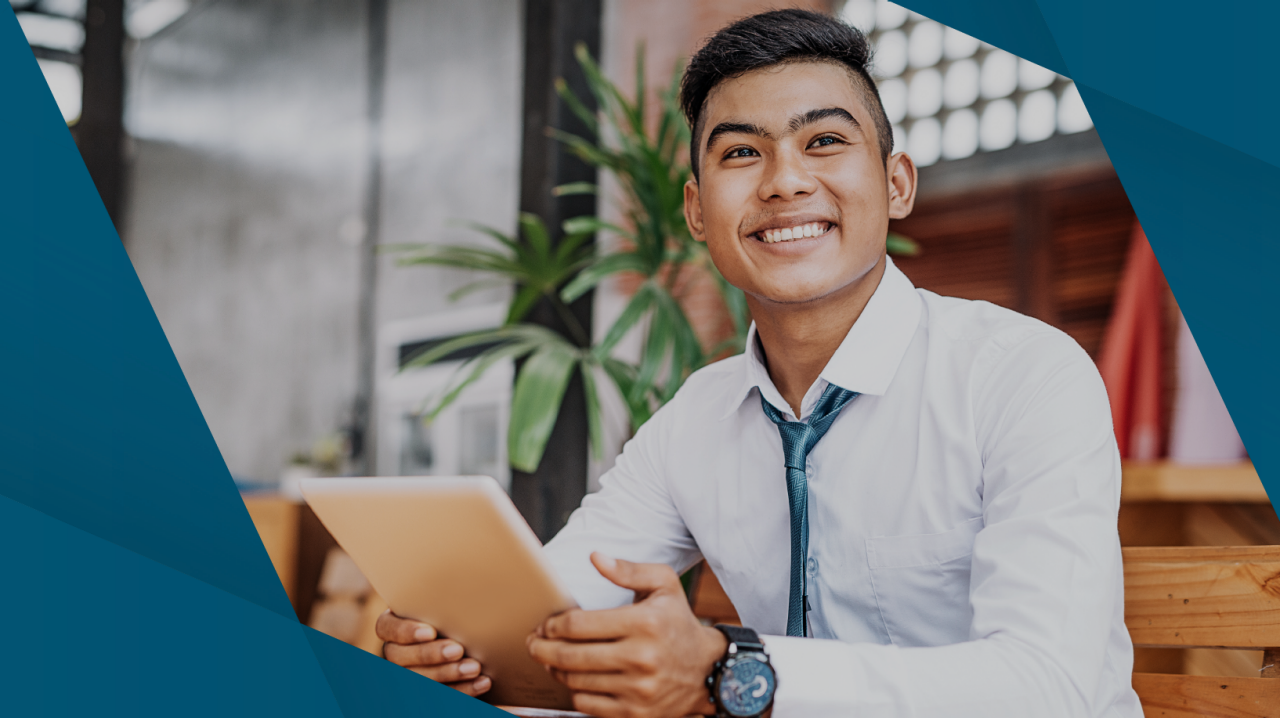 Man with ipad smiling